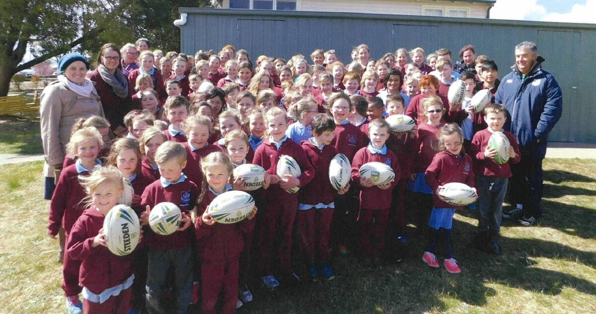 FOOTY DEVELOPMENT: Bombala Public pupils gain new football skills during a visit from NRL game development officer Damian Kennedy.