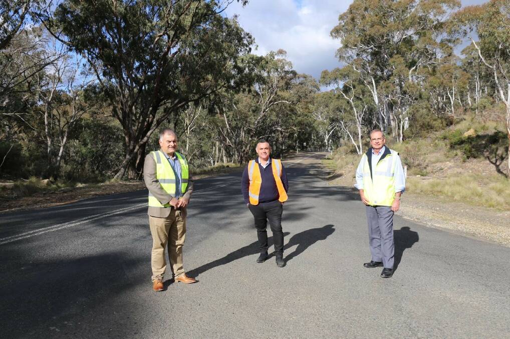 Member for Monaro John Barilaro, Queanbeyan-Palerang Regional Council mayor Tim Overall and councillor Trevour Hicks on Captains Flat Road on Friday.