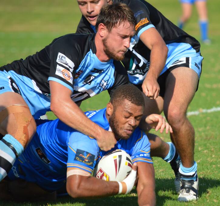 FIRST DRAW: Bombala Blue Heeler Tevita Badogo is tackled to the ground by Moruya in the first game of the season at Moruya where the game ended in a 26-all draw.