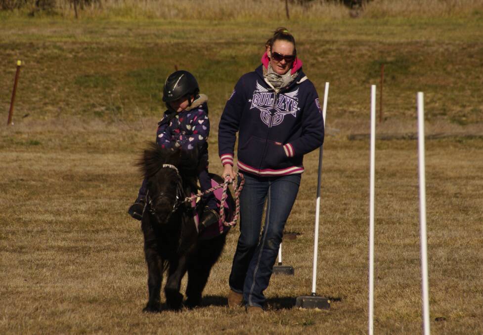 Billie Farran and Billy being instructed on how to lead by Julie Peadon at Saturday's Delegate Pony Club rally.