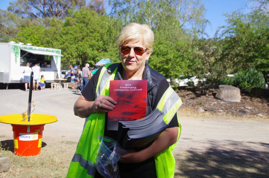 FINE DINING: Nola Brady selling copies of the 2019 Community Fundraising Cookbook at the Bombala Markets on Saturday.