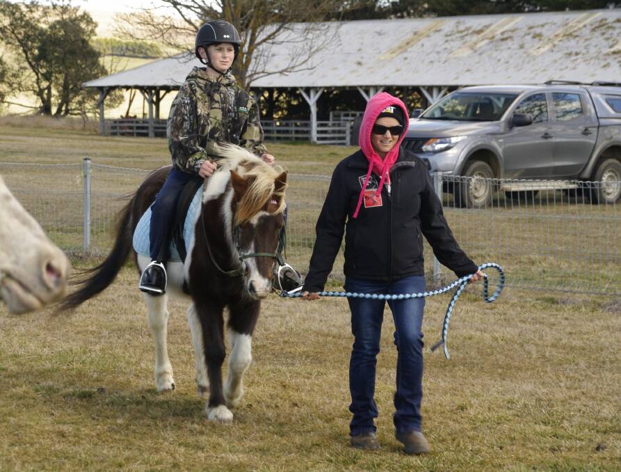 Cooper and Melissa Kidd braving the cooler weather at the Delegate Pony Club rally in Delegate on Saturday.