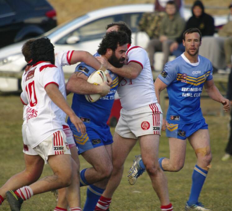 Brett Hodak powers his way through the Eden defence during Saturday's first grade game in Bombala.