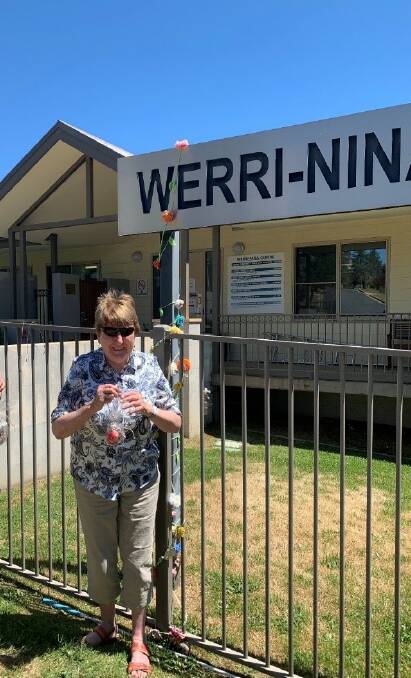 Snowy Monaro Community Connections Group member Lyn Byrne with one of the random acts of kindness gifts.