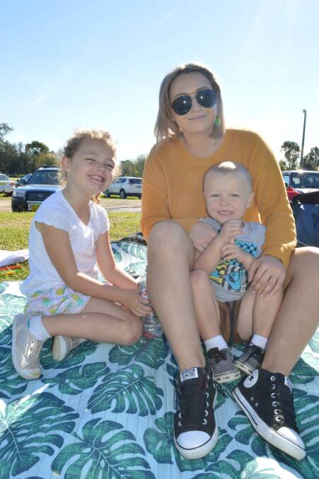 Nikki Fletcher with Indy and Jed Doyle of Eden were at the footy cheering on Bombala at Moruya on Sunday.