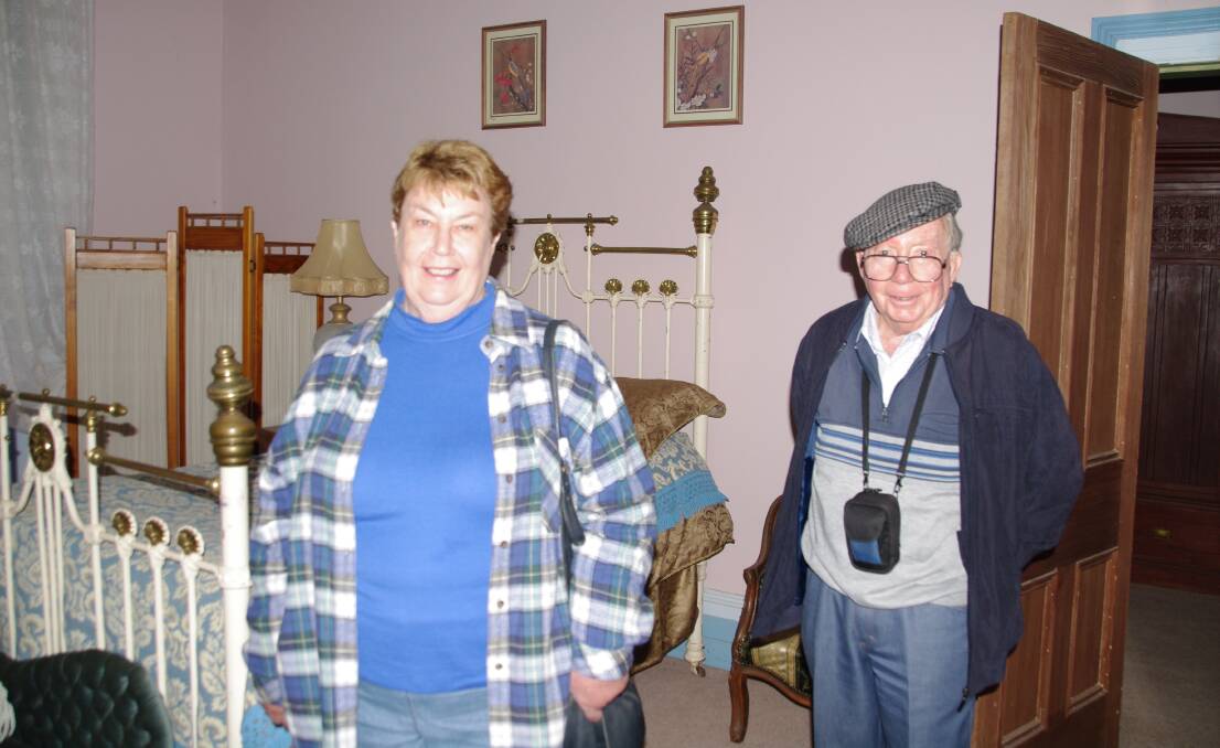 Helen Ellwood and Graham Savage check out one of the ten bedrooms at Burnima Homestead on a recent tour.