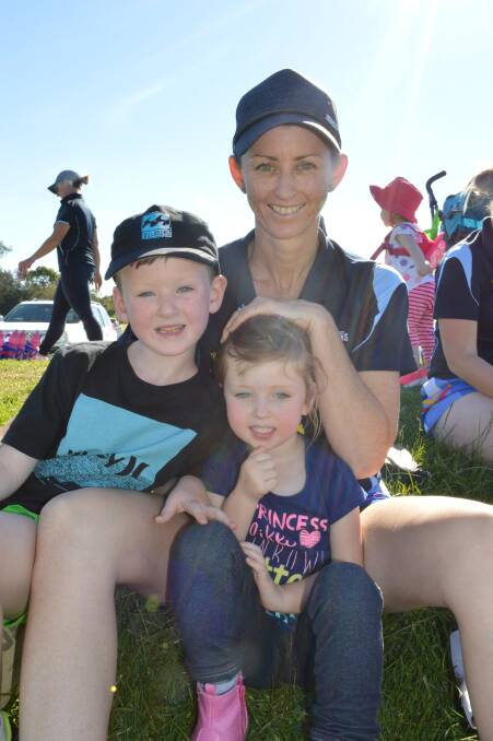 Brooke Morey with her biggest fans Cohen and Reegan watching the Bombala Blue Heelers at the rugby league Group 16 game in Moruya on Sunday.