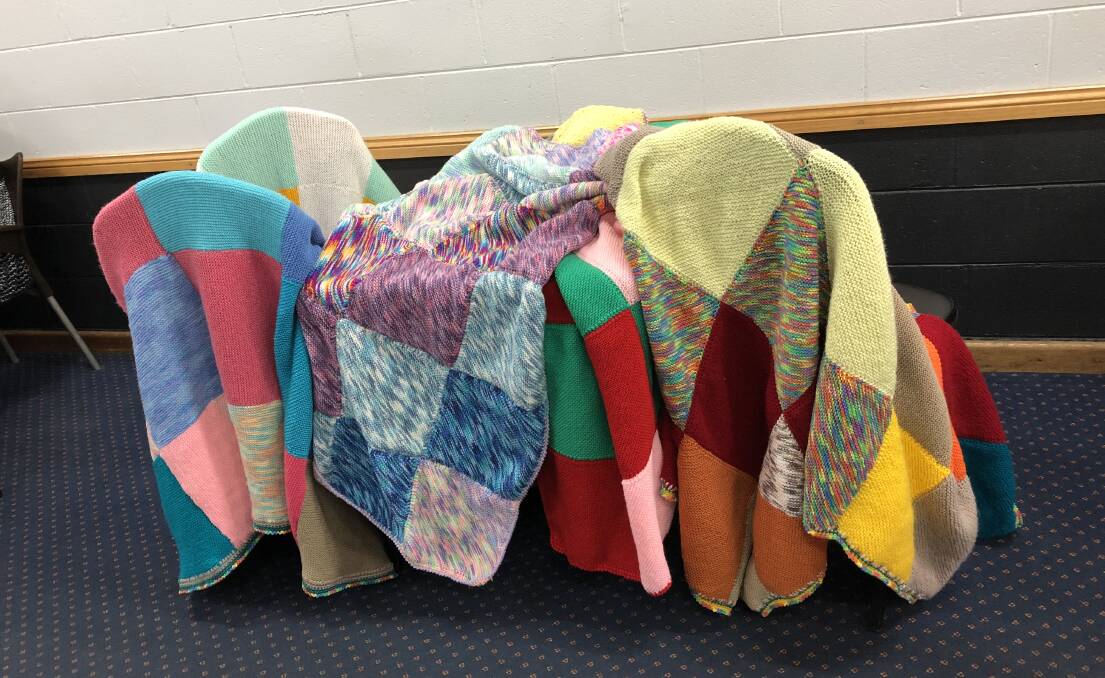 Some of the warm blankets handcrafter by Bombala 'Knit-n-Natter' group for the Wrapped With Love project.