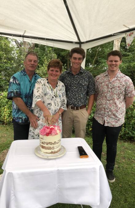 Carol Sellers, with husband Ian Sellers and sons Dom and Harry cut Carol's beautiful retirement cake at morning tea on Monday morning.