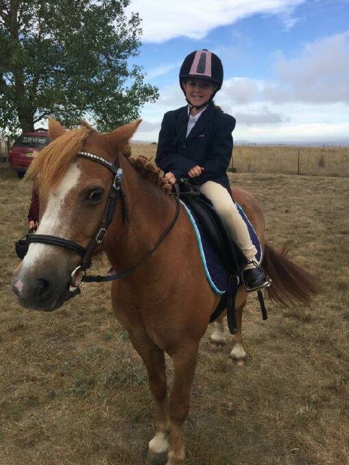 Delegate Pony Club member, Gabrielle Kid and her pony Tom Tom looking smart and ready to compete at the Nimmitabel Show.