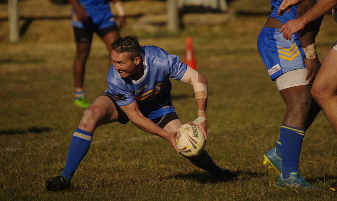 Bombala Blue Heeler Nick Ryan passes the ball during Saturday's Rugby League game against Eden.