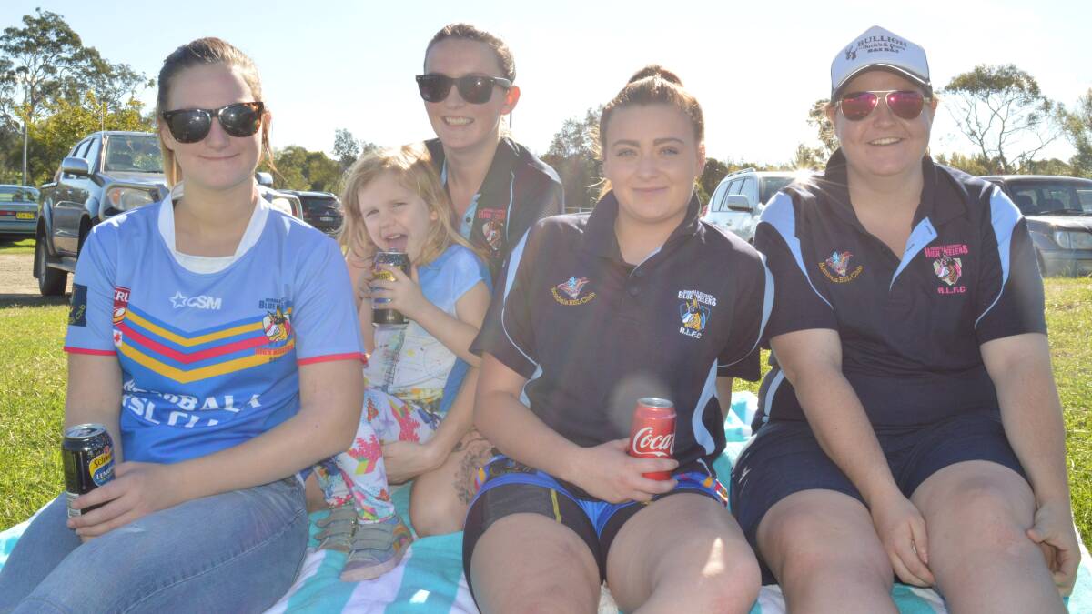Jade Crouch, Keiryn Mizon with daughter Ellora, Kayley Keavey and Makayla Standon cheering on Bombala after a hectic game of ladies league tag.