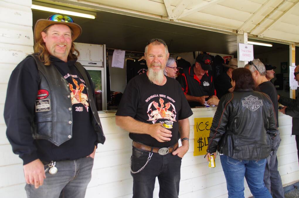 GREAT SHOW: Bombala Motor Cycle Association president, Darren Cotterill with Alan Talbot at the merchandising store at the Bombala Bike Show on Saturday.