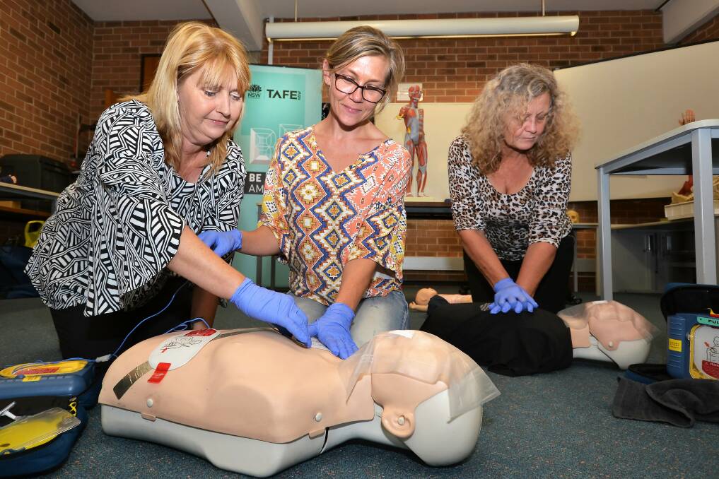 TAFE NSW First Aid teacher Georgie McInerney teaching life-saving skills to student Sandra Davis.
