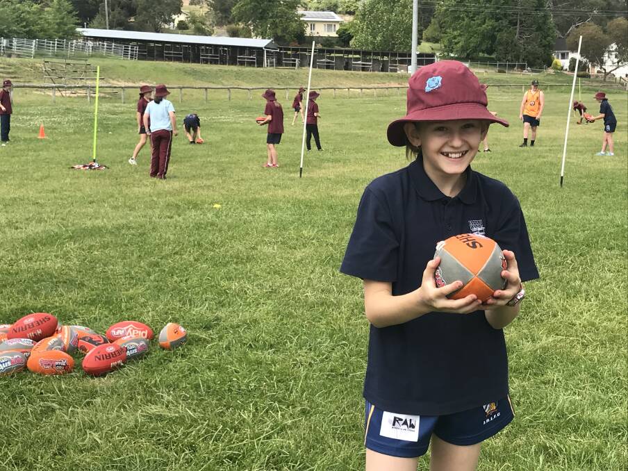 AFL SKILLS: Bombala Public School student Rachael Babidge not only had a lot of fun at the AFL Gala day she also learnt some new skills.