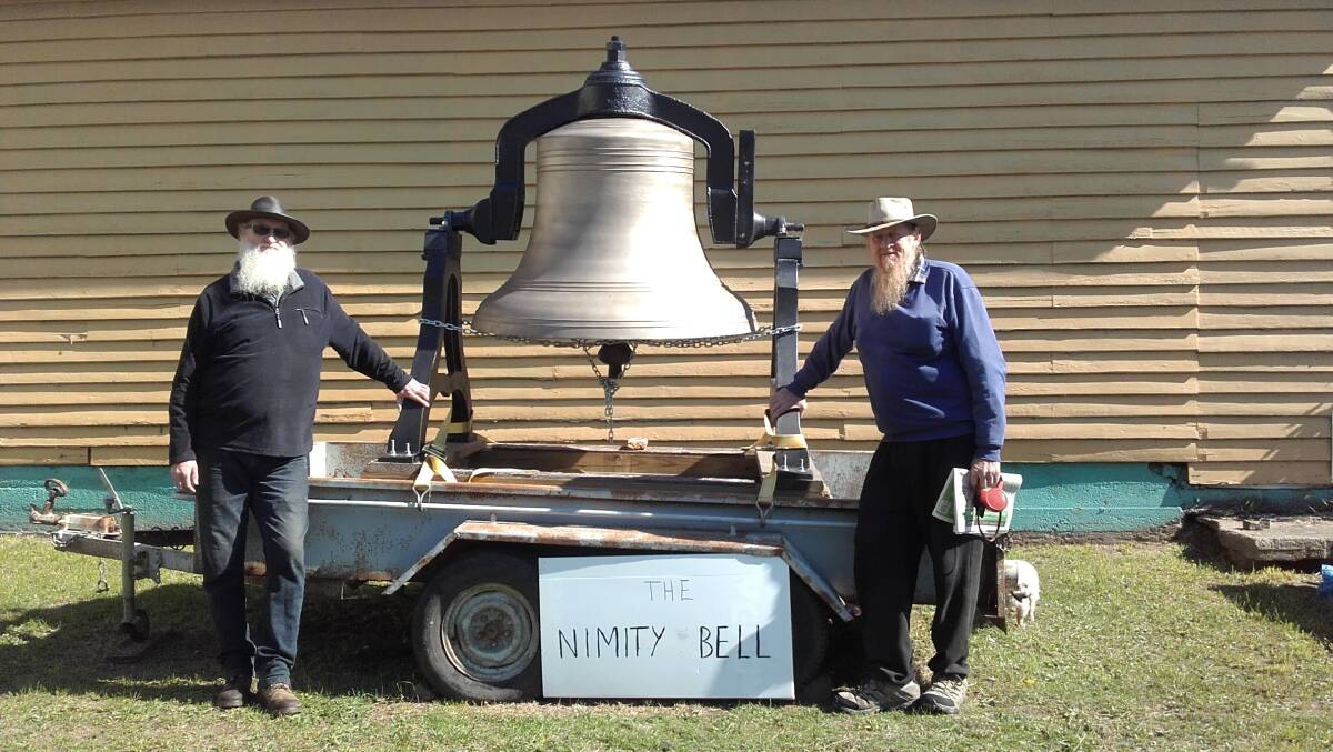Bell supporters - Nimmity locals Craig Schumacher, at left, and Jim Alcock  with the $30,000 bell that has sat forlorn in a trailer for two years awaiting a home.