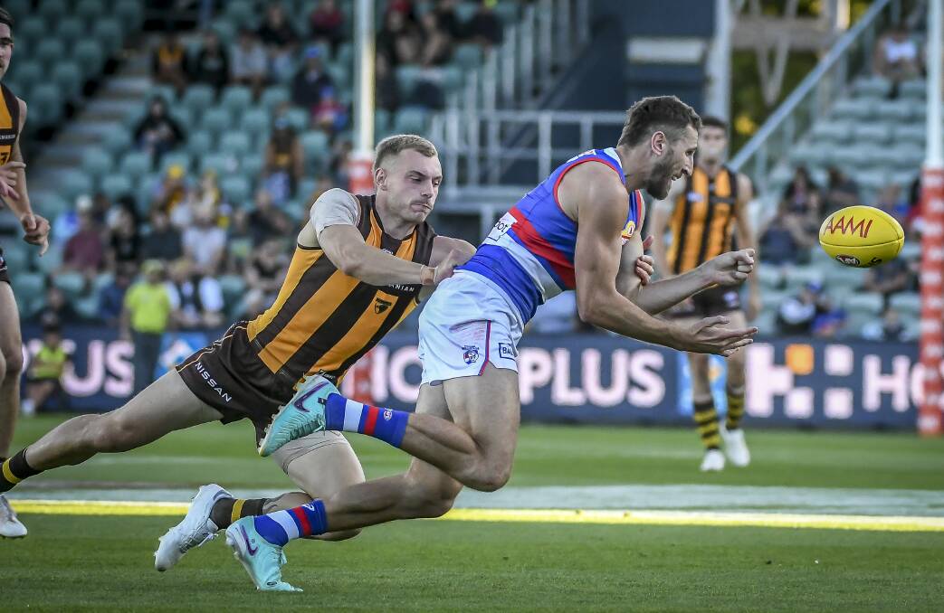 Western Bulldogs captain Marcus Bontempelli and Hawthorn's James Worpel at UTAS Stadium on Saturday, March 2. Picture by Craig George 