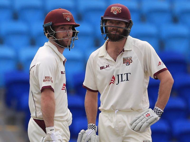 James Peirson (left) and Michael Neser have guided Queensland to a superb victory over Tasmania.