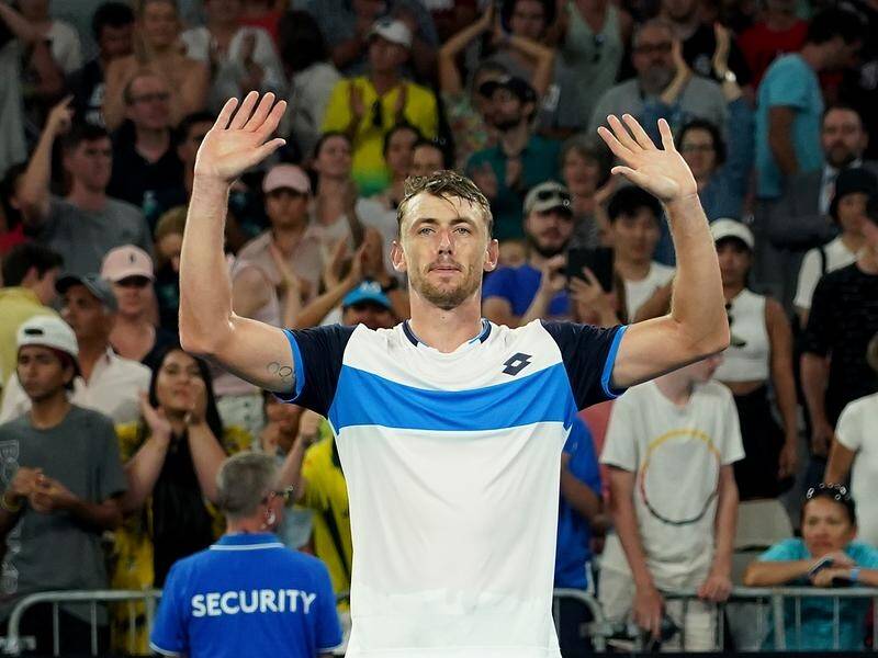 John Millman acknowledges the crowd after a win that may set up another clash with Roger Federer.