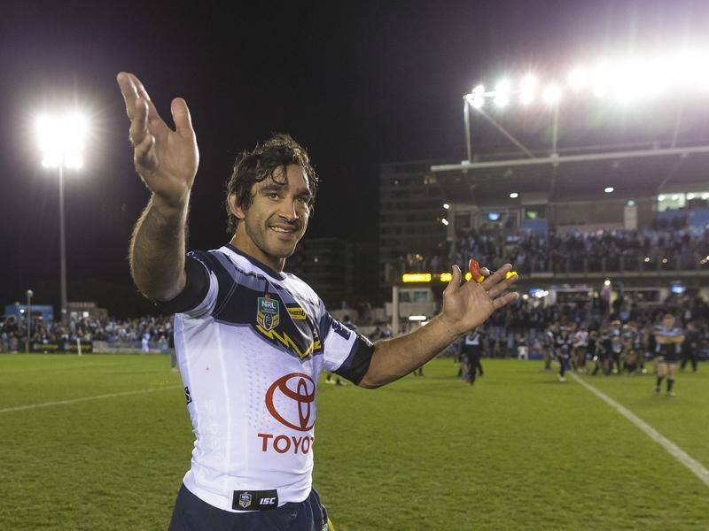 Cowboys' Johnathan Thurston salutes the Sharks crowd after his Sydney farewell.