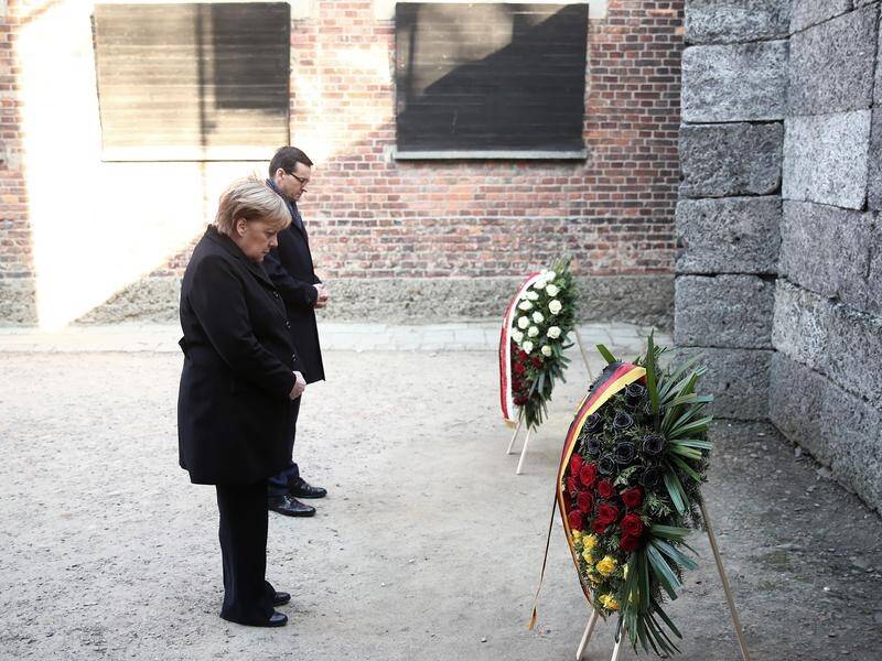 Angela Merkel says Germany remains committed to remembering the crimes it committed.