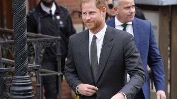Harry's lawyer says the prince may be forced to settle his claim against The Sun's publisher. (AP PHOTO)
