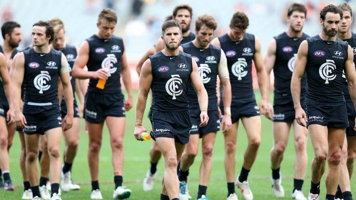 Carlton players trudge off following their defeat at the hands of Melbourne on Saturday. Photo: Pat Scala