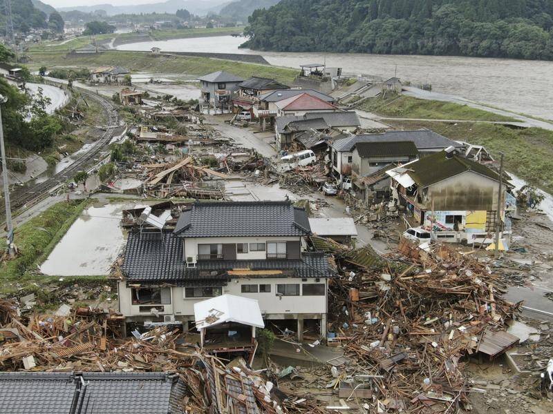 At least 34 people are confirmed or presumed dead after flooding in southern Japan.