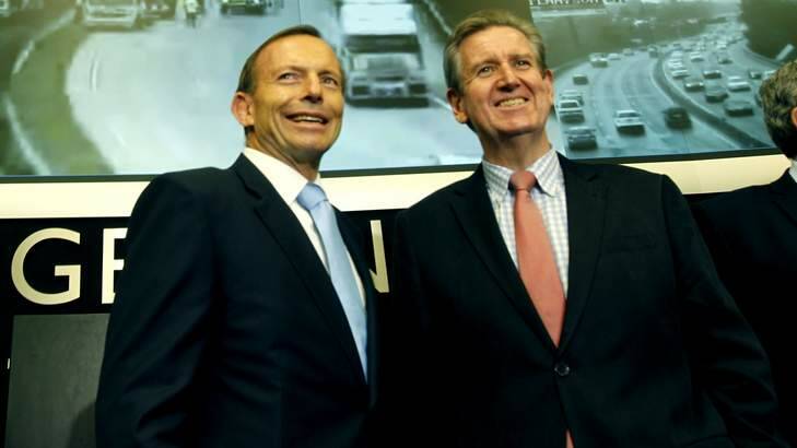 NSW Premier Barry O'Farrell, right, with Prime Minister Tony Abbott earlier this month. Mr O'Farrell has criticised Senator George Brandis over comments about bigots. Photo: Steven Siewert