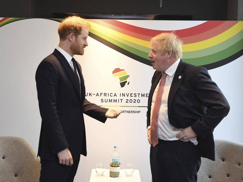 Prince Harry and PM Boris Johnson (r) at the UK Africa Investment Summit in London on Monday.