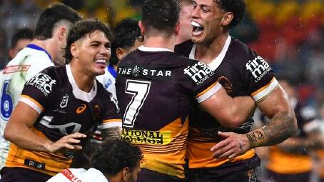 Brisbane fullback Reece Walsh (left) celebrates a try in the Broncos' 34-10 win over Canberra. (Jono Searle/AAP PHOTOS)