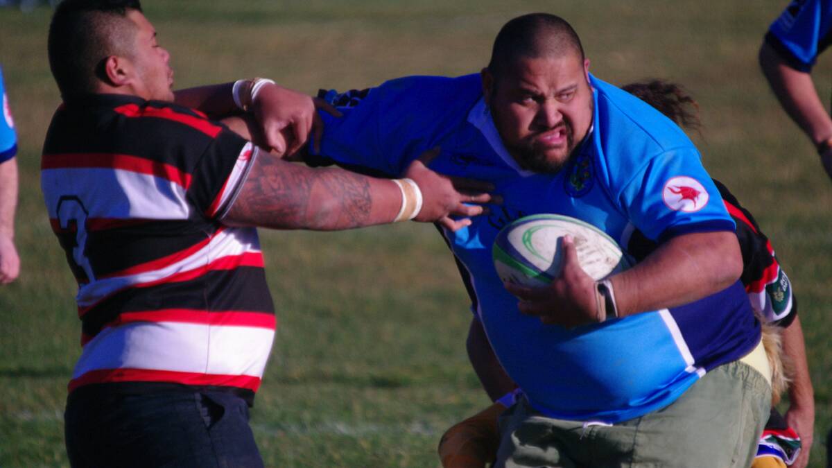 Vinnie Papalii, for the Bluetongues, palms off his Batemans Bay Reds opponent during Saturday’s clash.