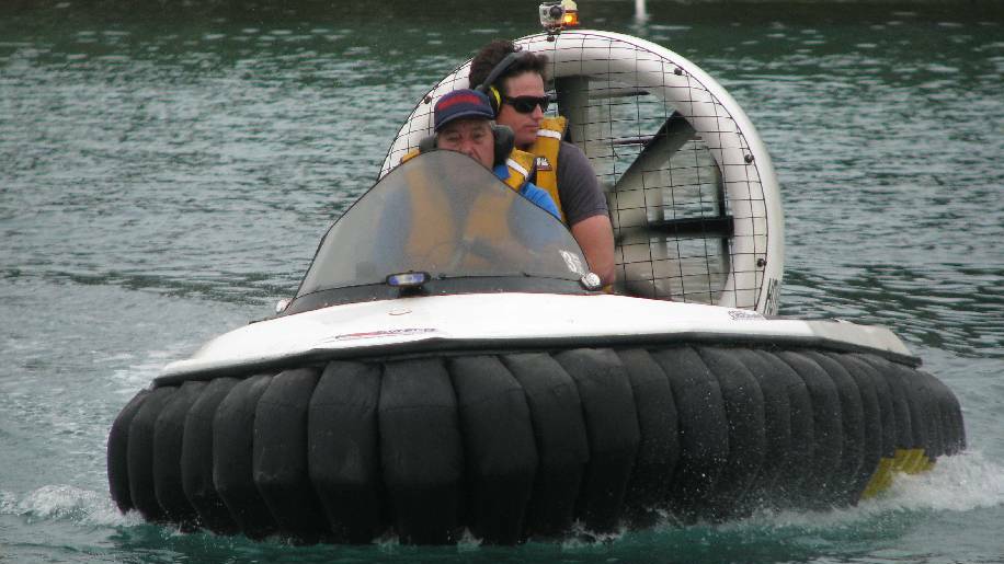 NAROOMA: Australian Seabird Rescue rescuer John Mendham takes Batemans Marine Park ranger Justin Gilligan for a spin around the inlet on one of two new hovercraft used for rescues.