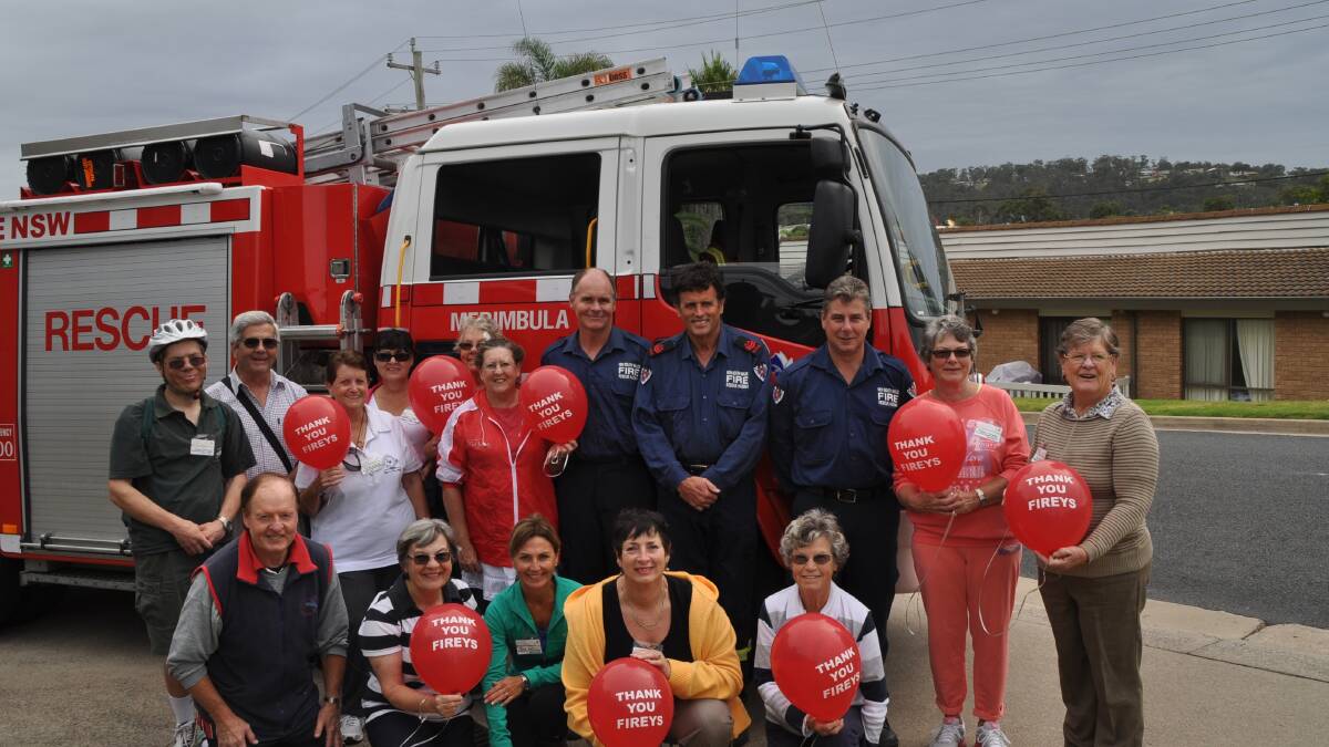 MERIMBULA: Red Balloon Day was a great opportunity for Sapphire Coast Walkers to say thanks to local firies. Craig Dickman, Mike Duncan and Rod Rowland of the Merimbula Town Brigade. 