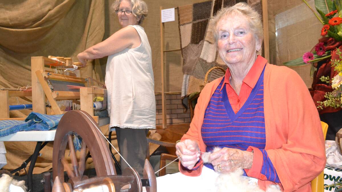 ULLADULLA: Spinning and weaving up a storm as they showed off old skills at the Milton Show were Murramarang Spinners members Claire Milner and Susan Curran.