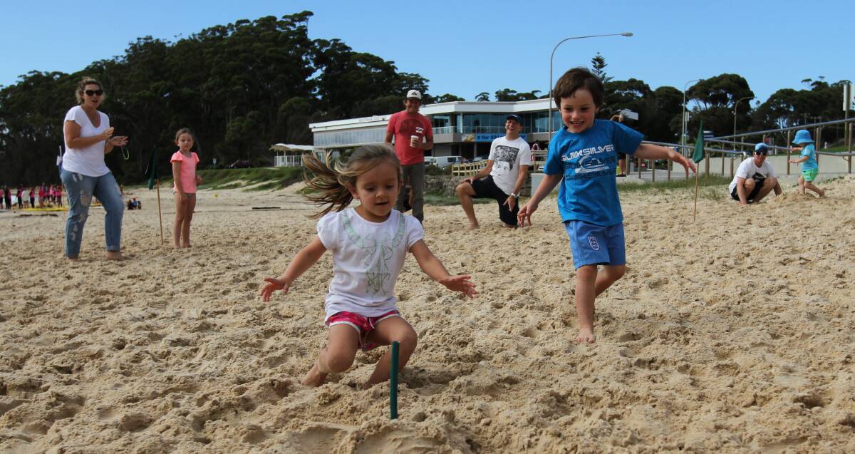 ULLADULLA: Tahlia Rushton takes out the three years flag race during the Sandgropers competition on Mollymook Beach. 