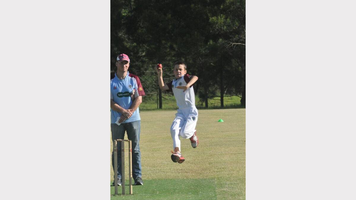  NOWRA: Adan Wood shows his wicket taking ability for North Nowra Cambewarra (Blues) under 12s against clubmates the Maroons on Saturday at Bernie Regan Oval. Photo: DAMIAN McGILL 