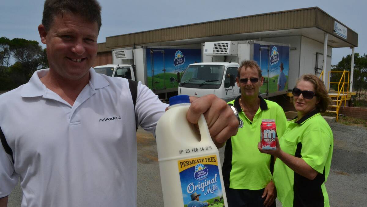 ULLADULLA: Matthew Williams (left), together with Dave and Jennie Rutherford are encouraging people to continue buying Dairy Farmers milk, despite a decision by local farmers to break away from the company. 