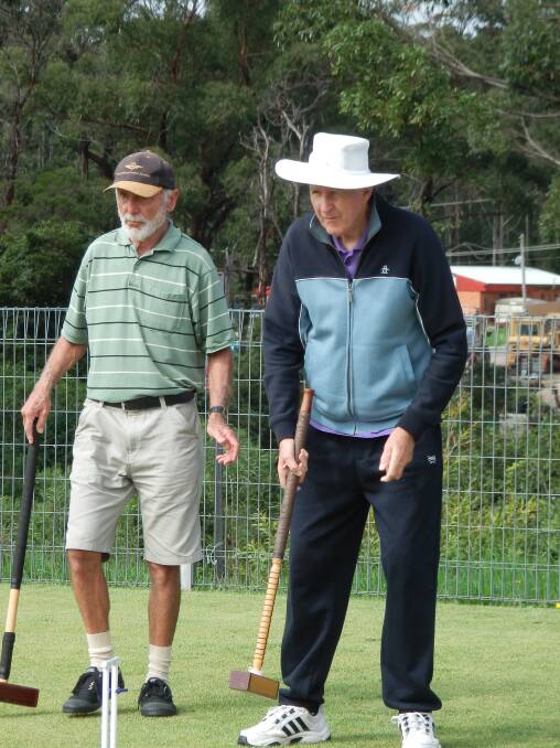 NAROOMA: “Boys at it again” at the Narooma Croquet Club are Alex Nitsche and Ken Cole planning next defensive move. 
