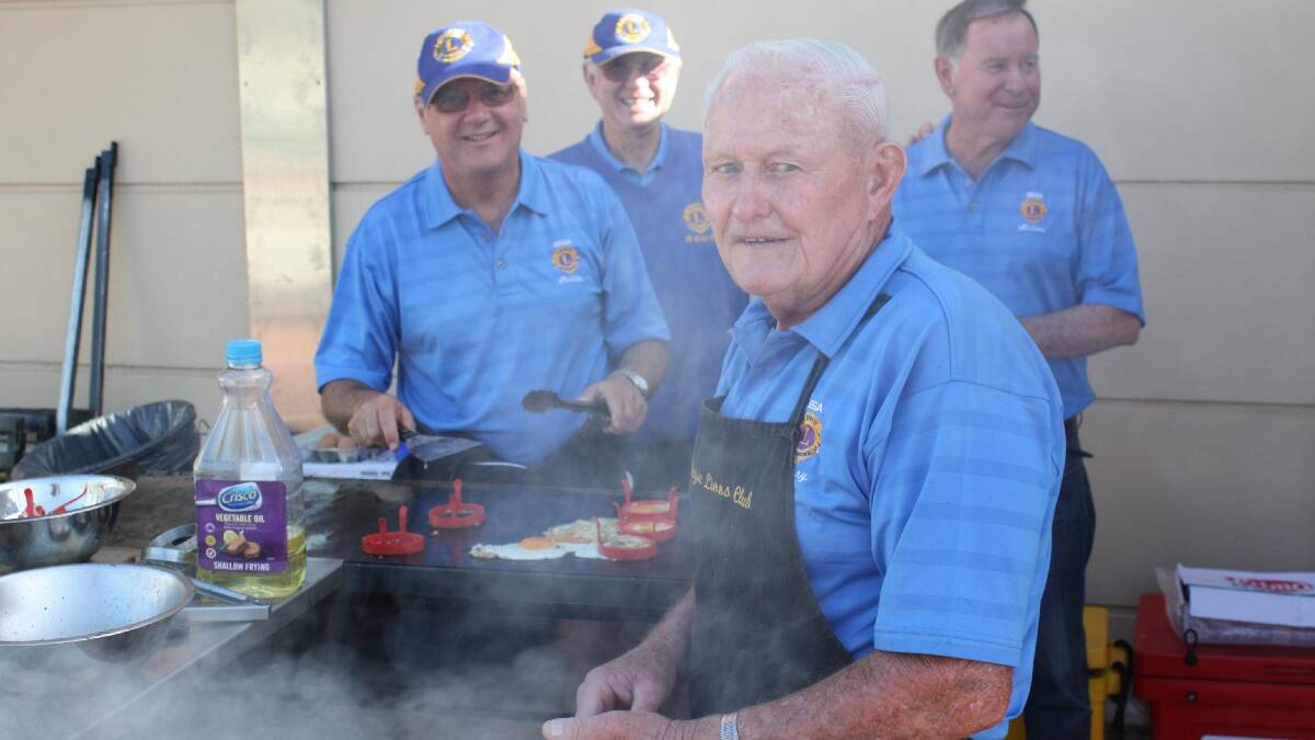 BEGA: Manning the Australia Day barbecue are Bega Lions Club members Denny Wiley and (back, from left) Ross Suter, Phil Benny and Mike Gowing. 