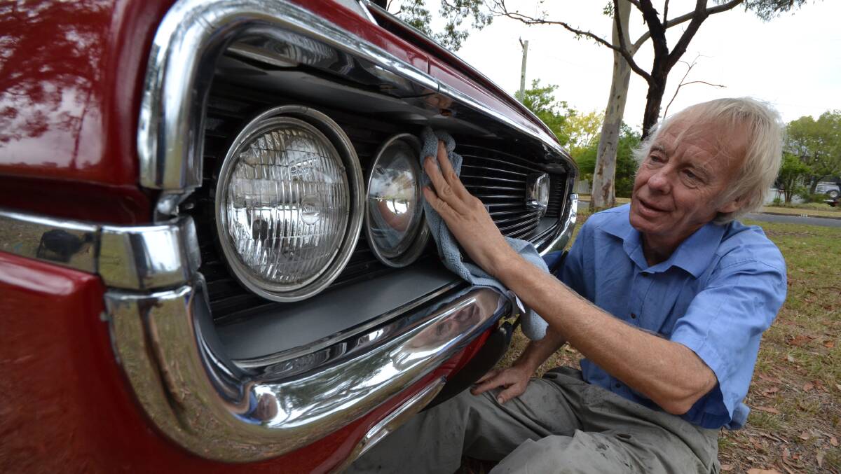 NOWRA: Toyota fan Andrew McIntosh with his beloved 1971 Crown,  known as Ruby. The proud Toyota owner said he was sad to hear the news of the brand’s decision to stop making cars in Australia in 2017.
  