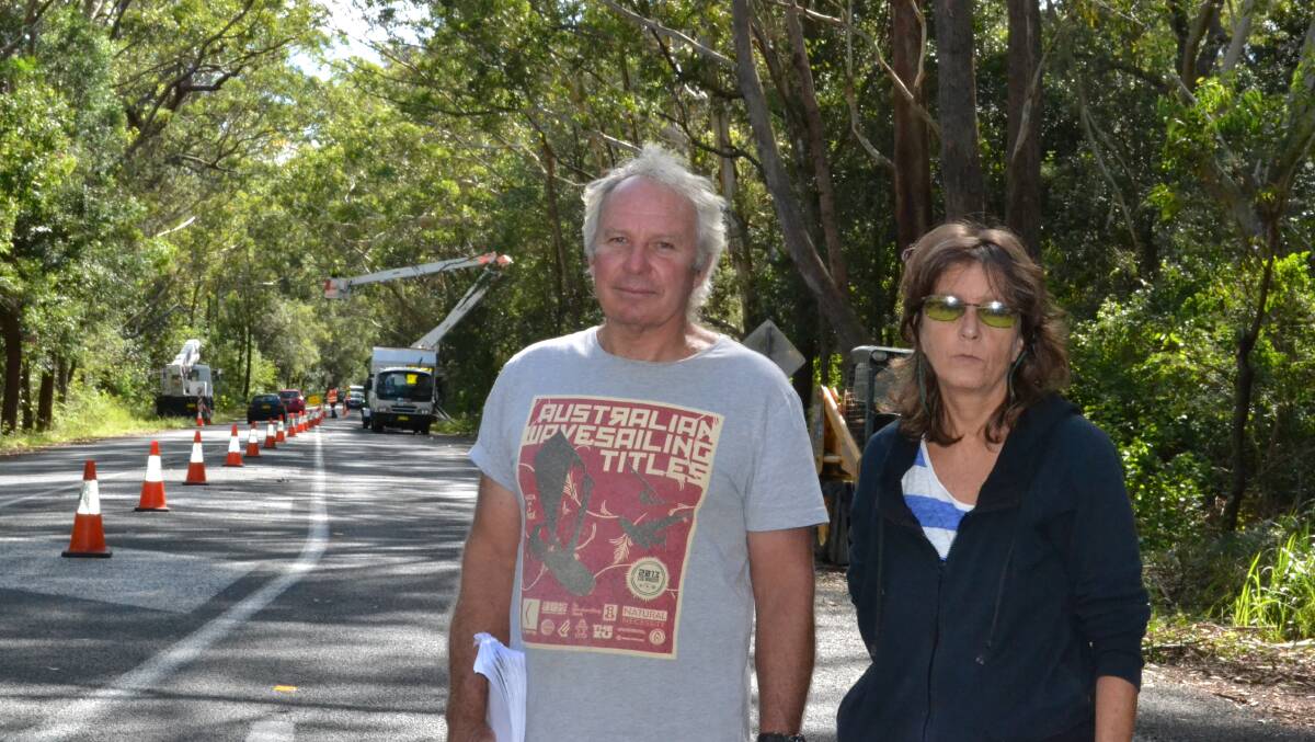NOWRA: President of the Gerroa Environmental Protection Society Warren Holder and Debra Moore of the Concerned Residents Group of Gerringong look disappointed as the clearing work starts north of the Beach Road intersection on Gerroa Road on Thursday morning.
  