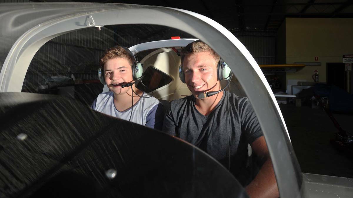 Rhys Nicholson, 14, and Ben Melton, 16, at a young pilots training camp at the Wagga air centre on Tuesday. Picture: Alastair Brook 