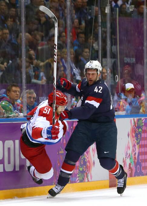  Fyodor Tyutin #51 of Russia collides with David Backes #42 of the United States during the Men's Ice Hockey Preliminary Round Group A game on day eight of the Sochi 2014 Winter Olympics. Photo by Streeter Lecka/Getty Images