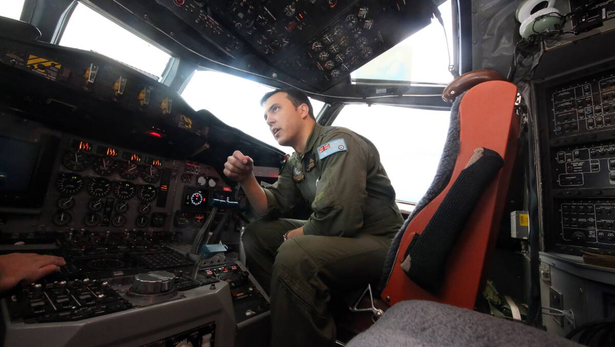Flt Lieutenant Josh Williams at the controls of a Royal Australian Air Force AP-3C Orion from RAAF base Pearce on assignment to Southern Indian Ocean to commence a search for possible debris from the Malaysian Airlines flight MH370 on March 24. Picture: Getty