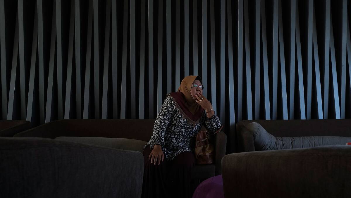 A family member of aviation engineer Mohamad Khairul Amri who was on flight MH370 reflects upon hearing the news on March 25, 2014 in Kuala Lumpur, Malaysia that satellite data showed flight MH370 crashed into the Southern Indian Ocean, with no survivors. Picture: Getty