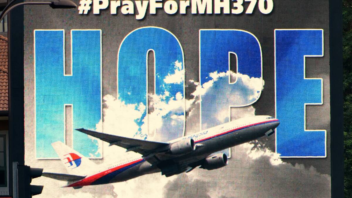 The week began with an electronic billboard displaying a message relating to missing Malaysian Airlines flight MH370 on March 23, 2014 in Kuala Lumpur, Malaysia. Picture: Getty