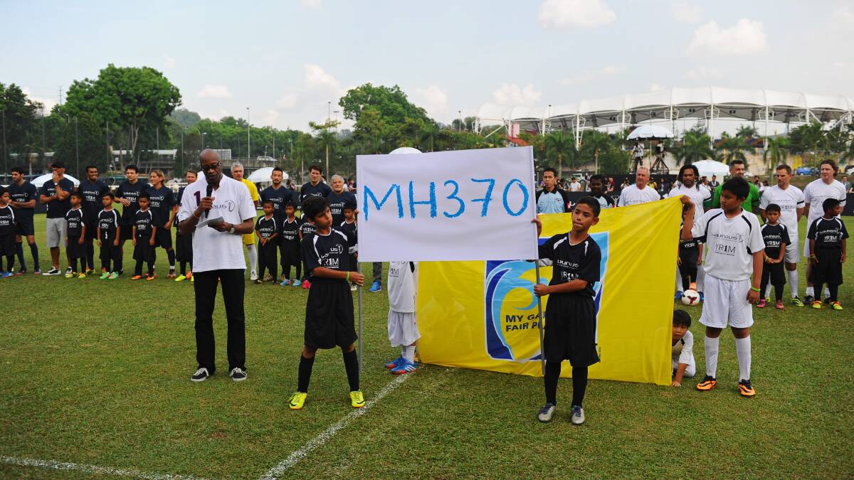 Laureus Chairman Edwin Moses speaks in rememberance of the 239 people killed in the flight MH370 tragedy during the Laureus All Stars Unity Cup ahead of the 2014 Laureus World Sports Awards at Royal Selangor Club on March 25, 2014 in Kuala Lumpur, Malaysia. Picture: Getty