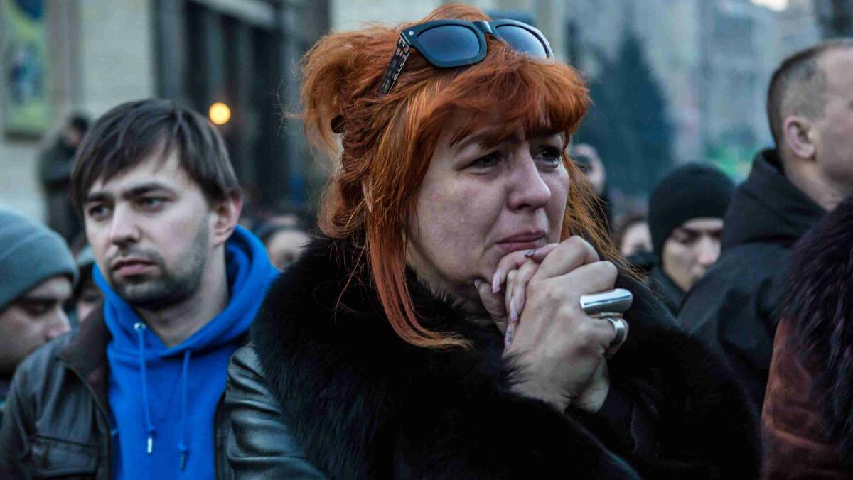 A woman mourns during a funeral procession for two anti-government protesters killed in fighting with police in Kiev. Picture: Getty Images