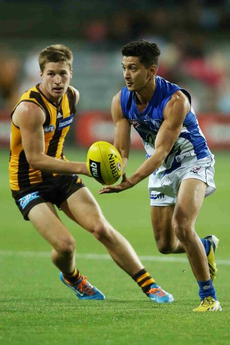 Robin Nahas of the Kangaroos handpasses the ball during the round two AFL NAB Challenge match between the Hawthorn Hawks and the North Melbourne Kangaroos at Aurora Stadium. Picture: Getty Images